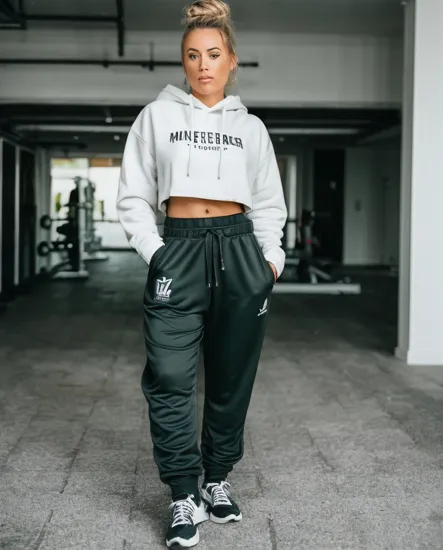 @Laura  New Zealand Fitness champion. Gangster rapper. Hip-hop. Baggy sweatpants. Baggy Hoodie. Red bandana. long blonde golden hair tied up in a bun.